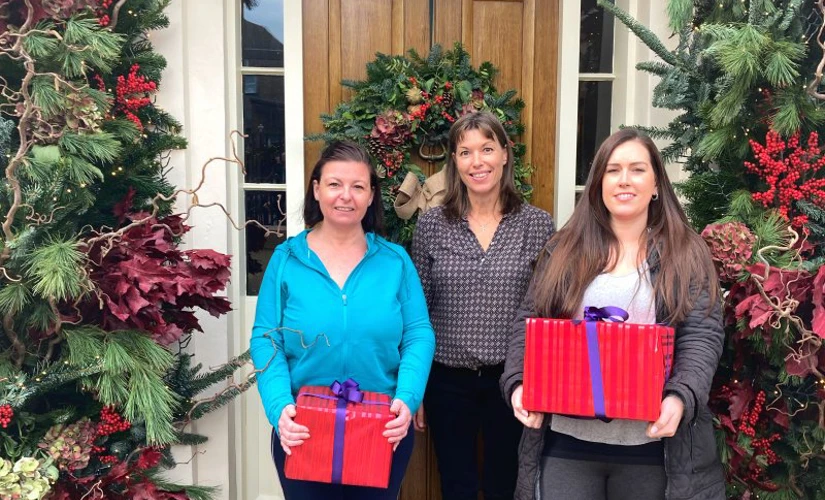 Jersey Skipton staff presenting Christmas presents 