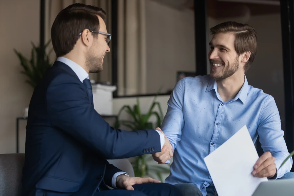 Two business men shaking hands