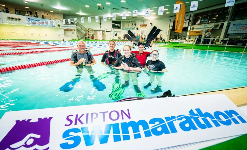 people in pool swimming in Skipton Swimarathon
