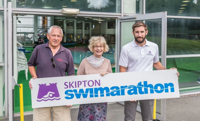 Skipton Swimarathon Beneficiaries holding large banner