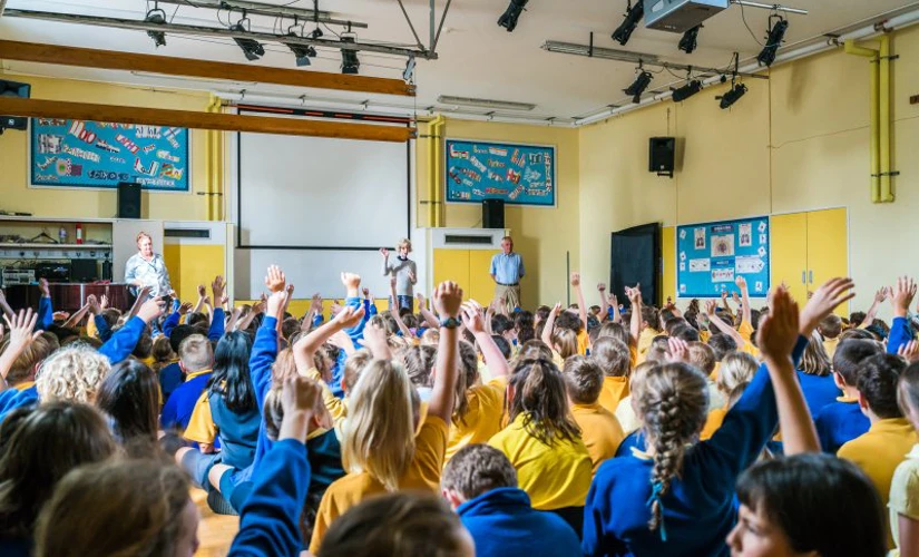 an assembly full of school children