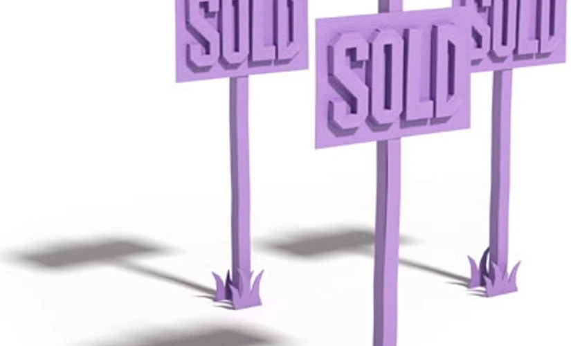 Three purple sold signs