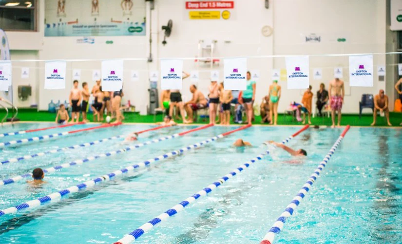 people in pool swimming in Skipton Swimarathon