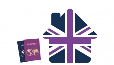 Union jack house alongside two passports