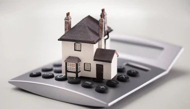 House model on oversized calculator