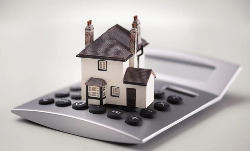 House model on oversized calculator