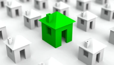 small animated houses with green house in focus