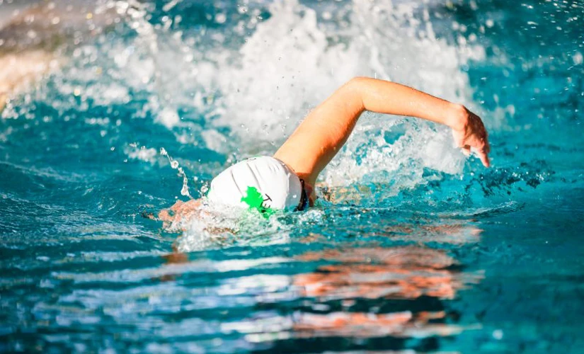 Person swimming in pool