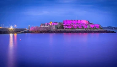 Castle Cornet lit up purple