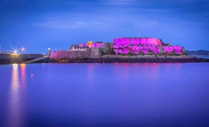 Castle Cornet lit up purple