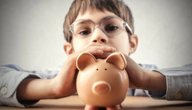 Child holding piggy bank
