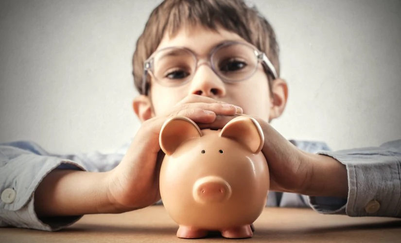 Child holding piggy bank