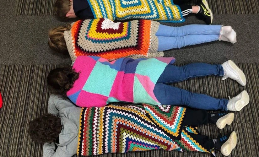 children wrapped in quilted blankets