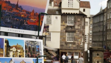 post cards on the side of a town path