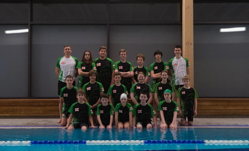 Guernsey water polo team next to pool