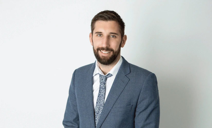 man smiling on grey background