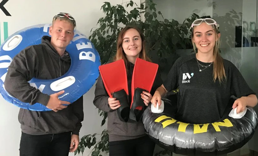 Young group with swimming equipment  