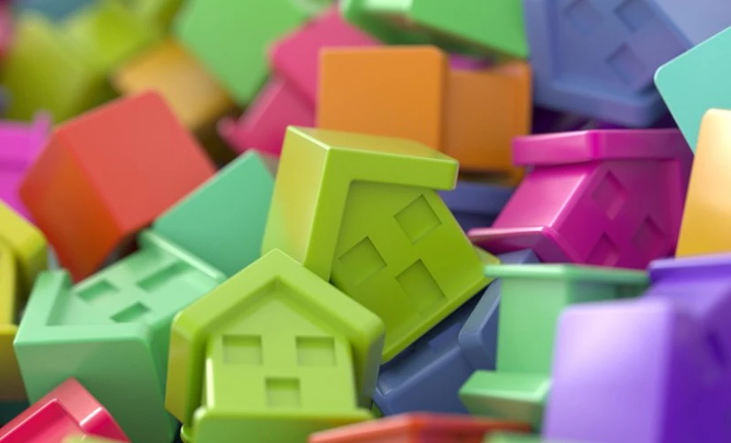 pile of coloured acrylic houses