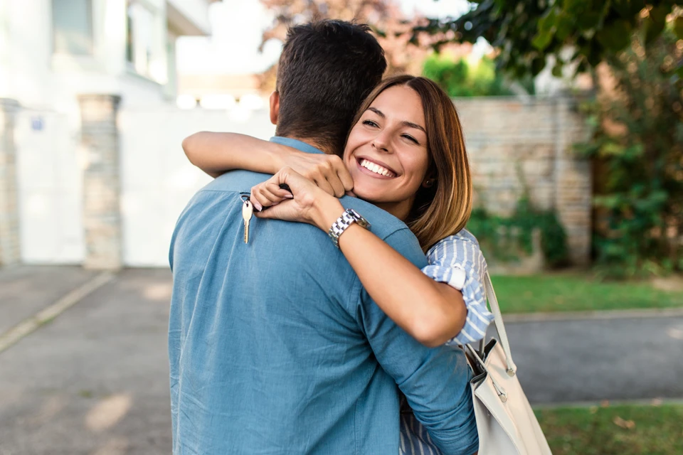 Mortgage Young Couple Hugging
