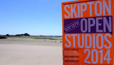 Skipton Studios sign on beach