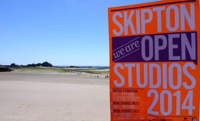 Skipton Studios sign on beach